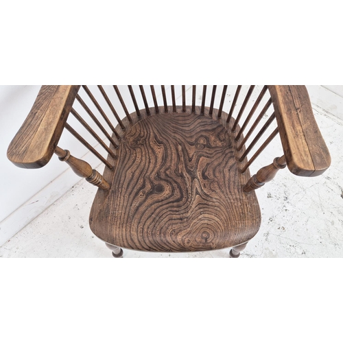 425 - WINDSOR ARMCHAIR, 19th century beechwood and elm with comb back, 96cm H x 65cm.