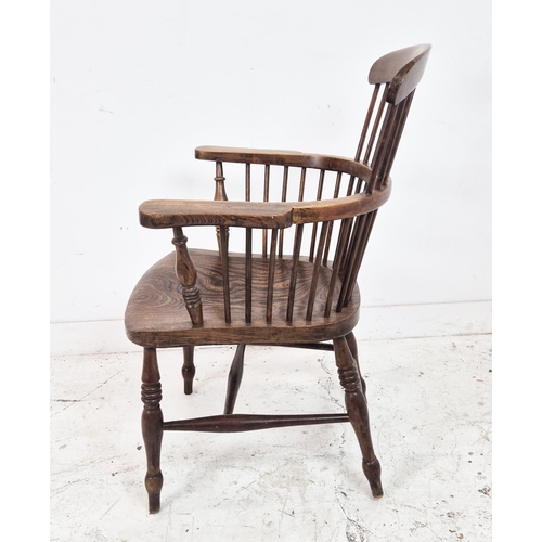 425 - WINDSOR ARMCHAIR, 19th century beechwood and elm with comb back, 96cm H x 65cm.