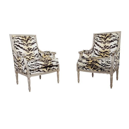 462 - ANDREW MARTIN BERGERE ARMCHAIRS, a pair, in animal print velvet, each 66cm x 100cm H x 70cm. (2)