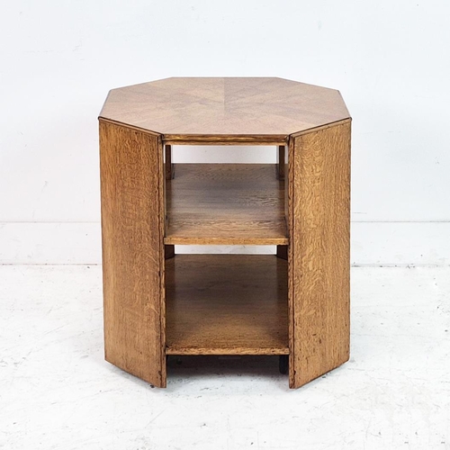 474 - MAPLE & CO BOOKCASE, circa 1920, oak of octagonal form on castors, labelled, 57cm H x 55cm.