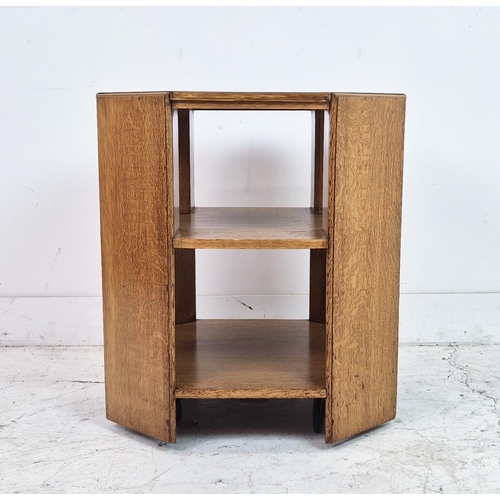 474 - MAPLE & CO BOOKCASE, circa 1920, oak of octagonal form on castors, labelled, 57cm H x 55cm.