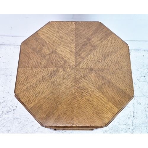 474 - MAPLE & CO BOOKCASE, circa 1920, oak of octagonal form on castors, labelled, 57cm H x 55cm.