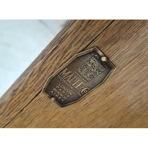 474 - MAPLE & CO BOOKCASE, circa 1920, oak of octagonal form on castors, labelled, 57cm H x 55cm.