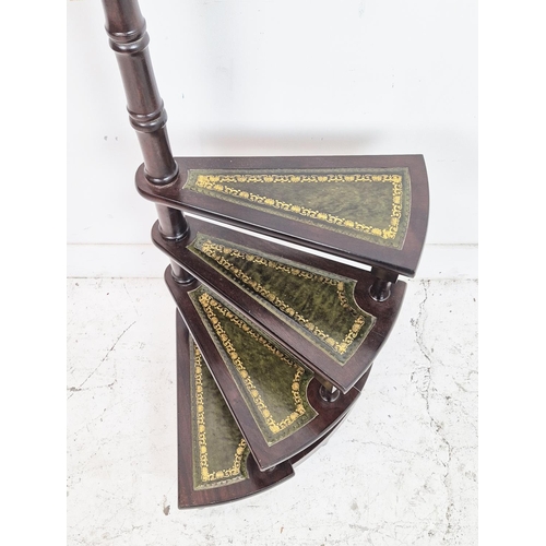 483 - LIBRARY STEPS, mahogany and brass with green leather spiral treads, 111cm H x 43cm.