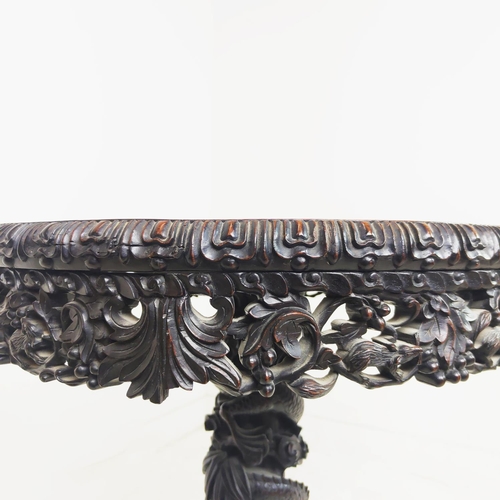 514 - CENTRE TABLE, 19th century Chinese padoukwood with circular inset marble top on dragon carved tripod... 