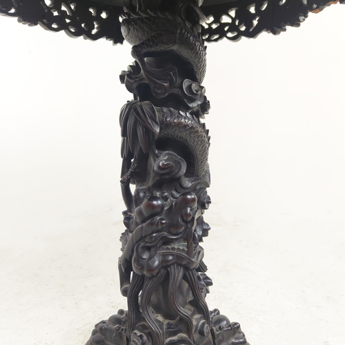 514 - CENTRE TABLE, 19th century Chinese padoukwood with circular inset marble top on dragon carved tripod... 