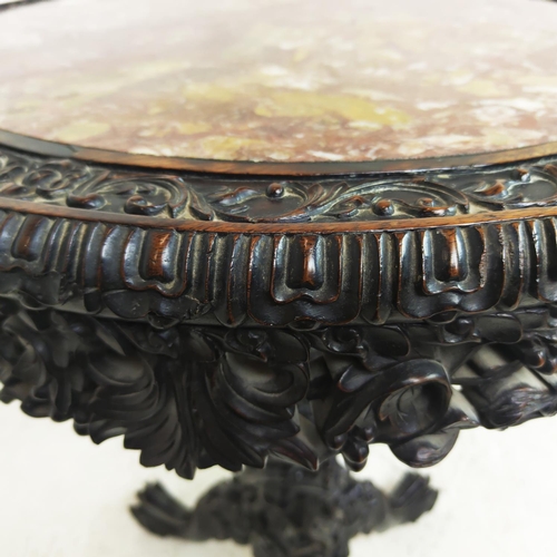 514 - CENTRE TABLE, 19th century Chinese padoukwood with circular inset marble top on dragon carved tripod... 