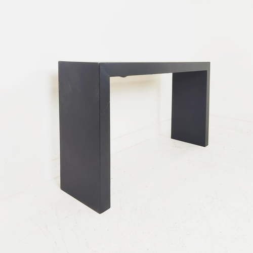 519 - AURA LONDON CONSOLE TABLE, black leathered finish, 140.5cm x 35cm x 76cm.