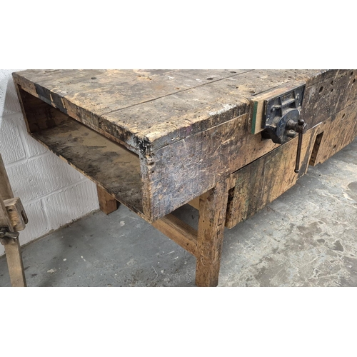 523 - WORKBENCH, 20th century pine with two fixed vices and three deep drawers, 89cm H x 305cm W x 89cm D.