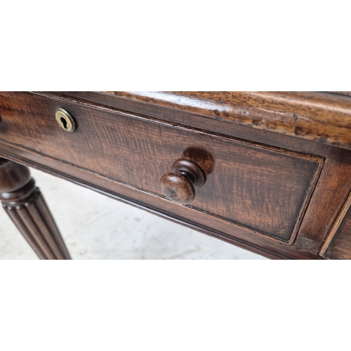 530 - WRITING TABLE, William IV mahogany, circa 1830, with black leather top above two drawers on ceramic ... 