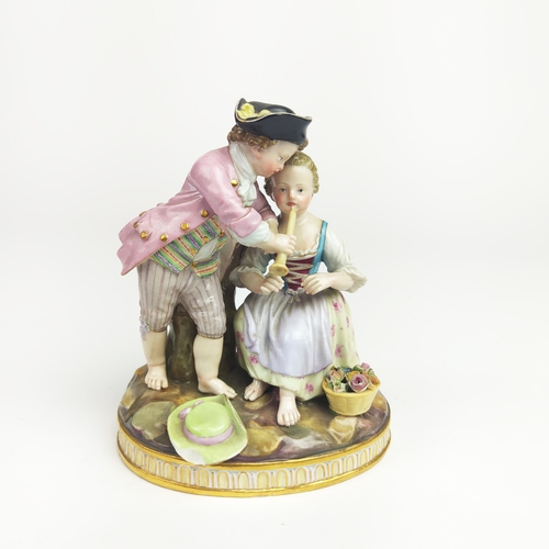 22 - MEISSEN FIGURE GROUP DEPICTING A LADY, gentleman and boy holding a chain, urn to centre, a Meissen f... 