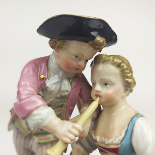 22 - MEISSEN FIGURE GROUP DEPICTING A LADY, gentleman and boy holding a chain, urn to centre, a Meissen f... 