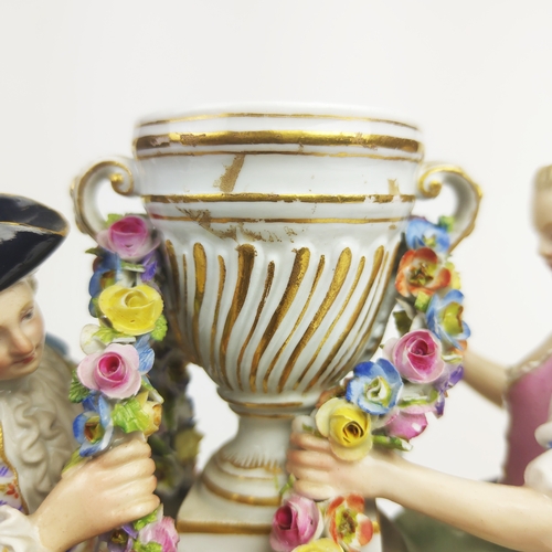 22 - MEISSEN FIGURE GROUP DEPICTING A LADY, gentleman and boy holding a chain, urn to centre, a Meissen f... 