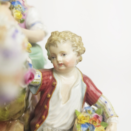 22 - MEISSEN FIGURE GROUP DEPICTING A LADY, gentleman and boy holding a chain, urn to centre, a Meissen f... 