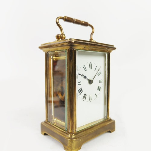 26 - CARRIAGE CLOCKS, three, 19th/20th century brass together with a tortoiseshell mantle clock. (4)