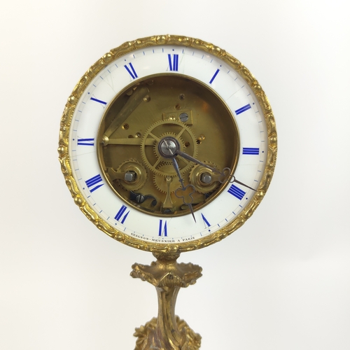 28 - MANTEL CLOCK, French early 19th century Rococo style, gilt bronze, glass dome and circular base.