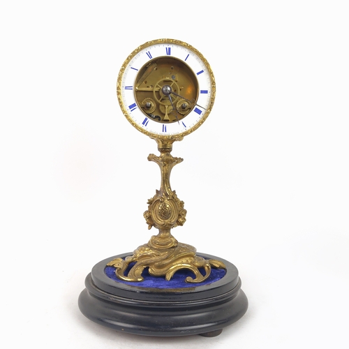 28 - MANTEL CLOCK, French early 19th century Rococo style, gilt bronze, glass dome and circular base.