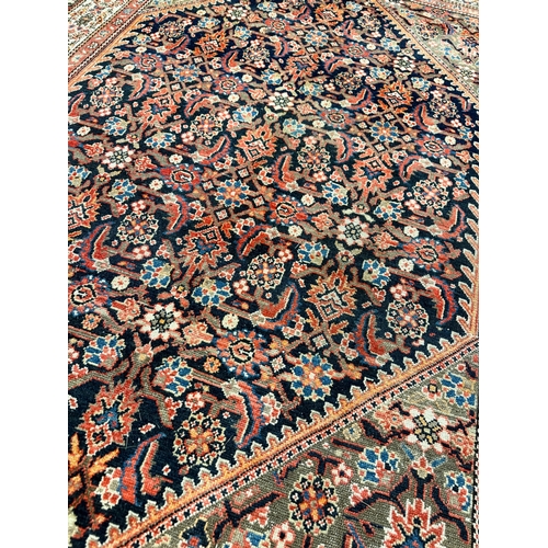 302 - ANTIQUE MALAYER RUG, 193cm x 137cm.