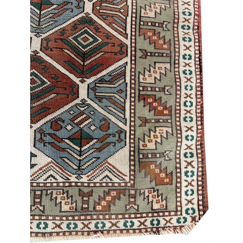 304 - ANTIQUE CAUCASIAN RUG, 141cm x 121cm.