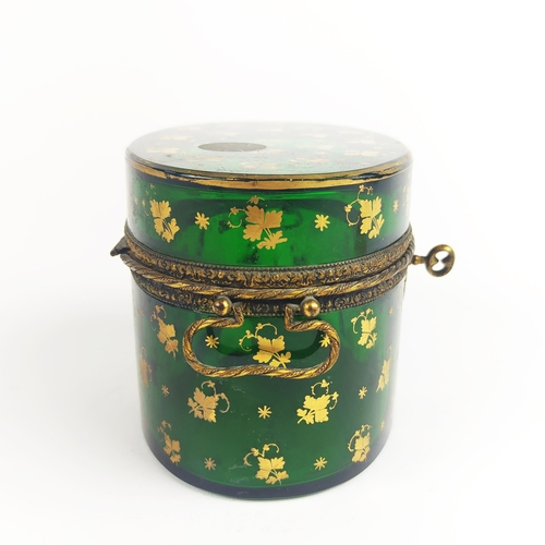 31 - BRISTOL EMERALD GLASS LIDDED CASKET, gold leaf motif decoration, oval form, twin handles, 10cm H.