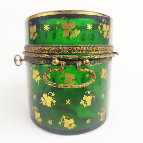 31 - BRISTOL EMERALD GLASS LIDDED CASKET, gold leaf motif decoration, oval form, twin handles, 10cm H.