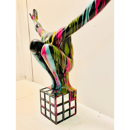 450 - CONTEMPORARY SCHOOL DIVER SCULPTURE, polychrome paint splattered finish on a mirrored base, 81cm H x... 