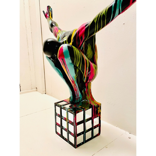 450 - CONTEMPORARY SCHOOL DIVER SCULPTURE, polychrome paint splattered finish on a mirrored base, 81cm H x... 