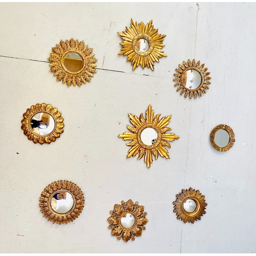 453 - SUNBURST WALL MIRRORS, a collection of nine, gilt frames, of various sizes and designs. (9)