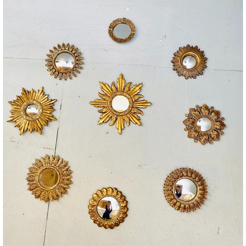 453 - SUNBURST WALL MIRRORS, a collection of nine, gilt frames, of various sizes and designs. (9)