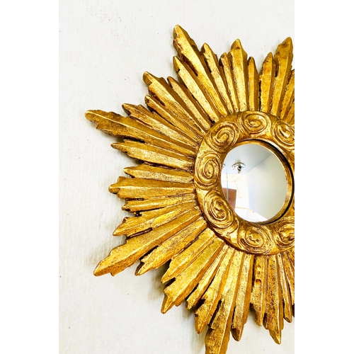 453 - SUNBURST WALL MIRRORS, a collection of nine, gilt frames, of various sizes and designs. (9)