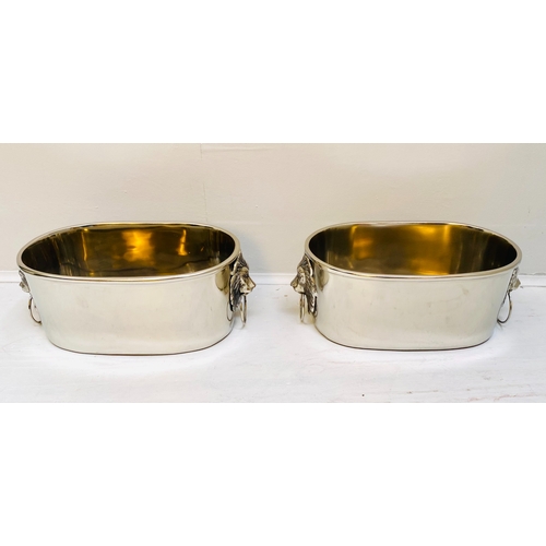 454 - CHAMPAGNE COOLERS, a pair, polished metal with lion head handles, 16cm H x 45cm x 26cm. (2)