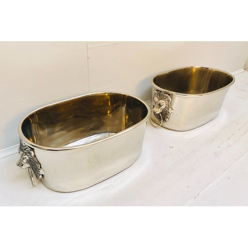 454 - CHAMPAGNE COOLERS, a pair, polished metal with lion head handles, 16cm H x 45cm x 26cm. (2)