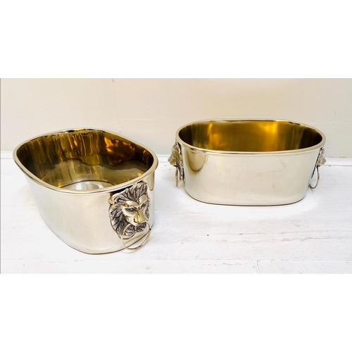 454 - CHAMPAGNE COOLERS, a pair, polished metal with lion head handles, 16cm H x 45cm x 26cm. (2)