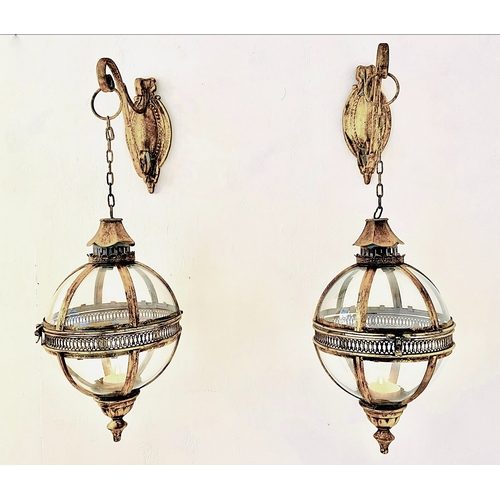 455 - WALL HANGING GLOBE LANTERNS, a pair, Regency style, gilt metal and glass, 80cm H x 25cm x 25cm. (2)