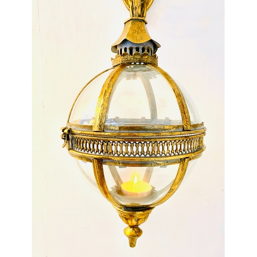 455 - WALL HANGING GLOBE LANTERNS, a pair, Regency style, gilt metal and glass, 80cm H x 25cm x 25cm. (2)