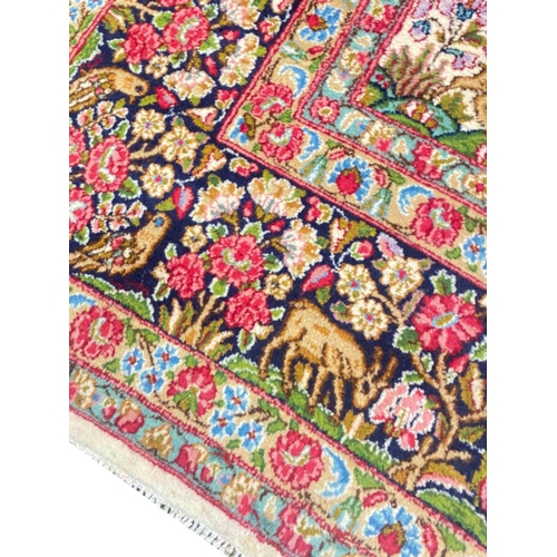 101 - ANTIQUE PERSIAN KERMAN LAVER CARPET, 390cm x 275cm.