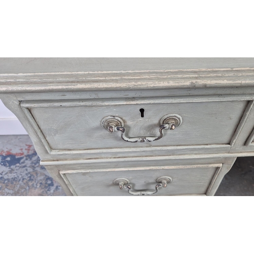 124 - PEDESTAL DESK, grey painted with black leather top above seven drawers, 77cm H x 122cm W x 61cm D, a... 