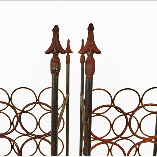 125 - WINE RACKS, a pair, wrought iron, each for thirty bottles, 132cm H x 36cm W x 34cm D. (2)