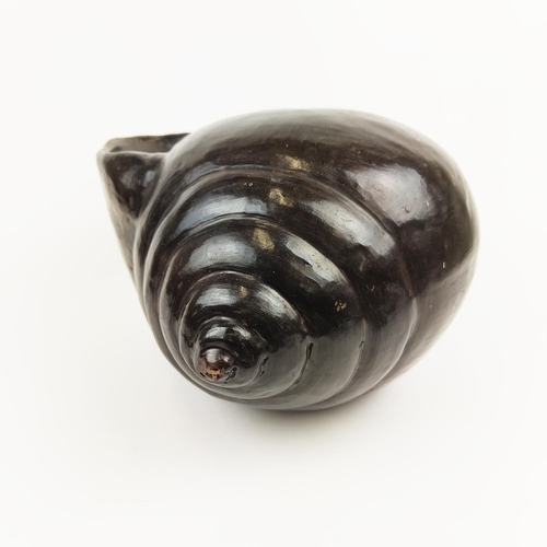 16 - A MODELLED TERRACOTTA SNAIL SHELL, 25cm high.