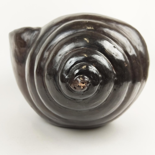 16 - A MODELLED TERRACOTTA SNAIL SHELL, 25cm high.