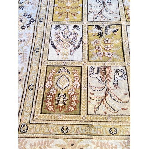 99 - FINE PURE SILK AND METAL THREAD HEREKE RUG, 240cm x 154cm.