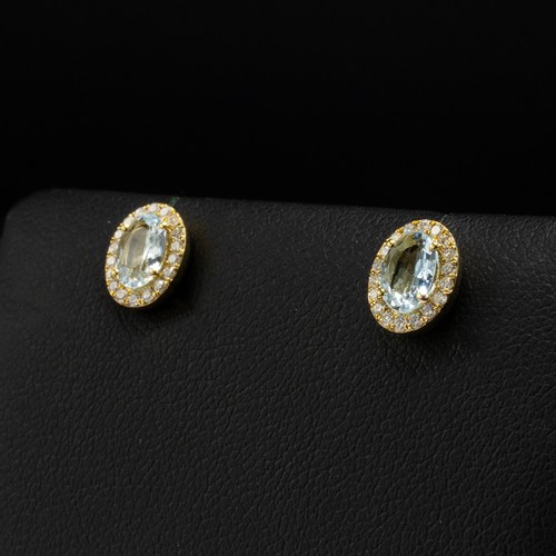 28 - Pair of 9ct yellow gold oval aquamarine and RBC diamond cluster studs, boxed. Aquamarines 0.73ct. Di... 