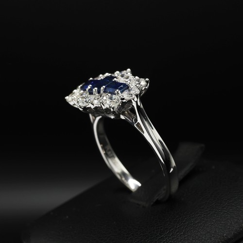 27 - Platinum sapphire and diamond boat-style dress ring. Sapphires 0.92ct. RBC diamonds 1.15ct.