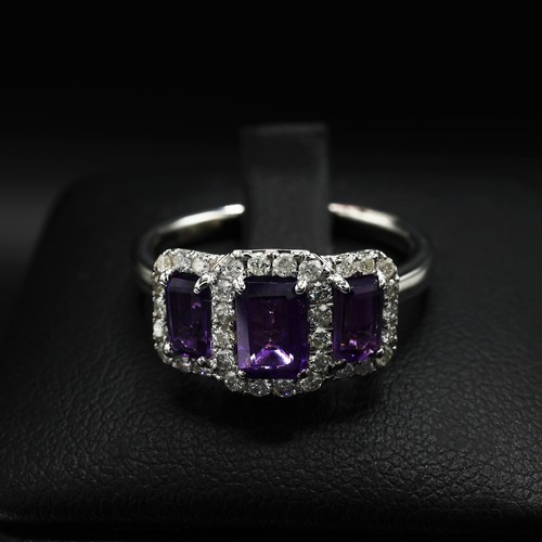 21 - 9ct white gold triple cluster dress ring set with step cut amethysts surrounded by RBC diamonds. Ame... 