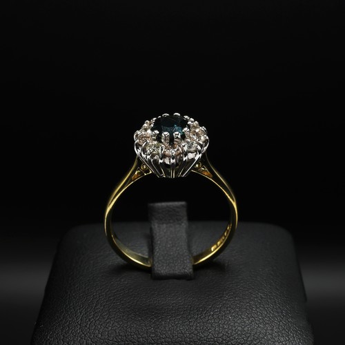 32 - 18ct yellow and white gold traditional oval sapphire and RBC diamond cluster ring. Sapphire 0.50ct. ... 