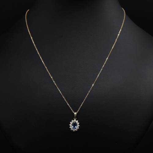 22 - 18ct white gold oval sapphire and RBC diamond cluster pendant on an 18ct white gold chain, boxed. Sa... 