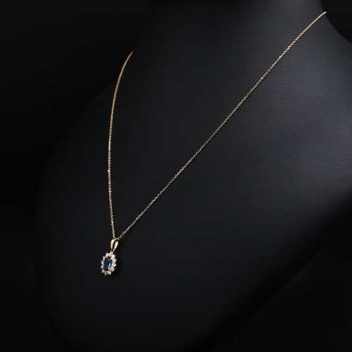 22 - 18ct white gold oval sapphire and RBC diamond cluster pendant on an 18ct white gold chain, boxed. Sa... 