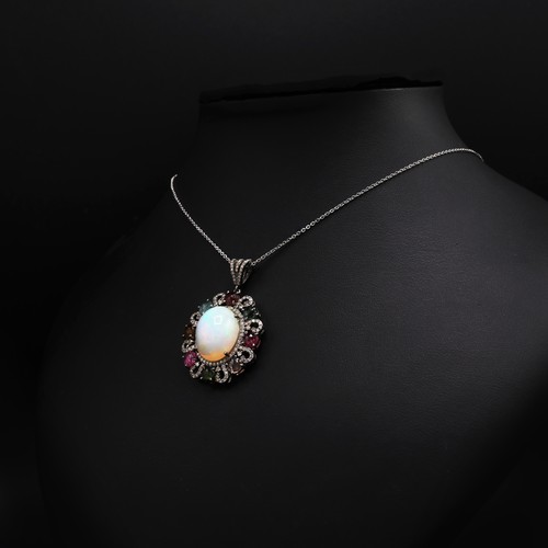 25 - Silver pendant set with large cabochon opal, multicolour tourmalines and rose-cut diamonds on a silv... 