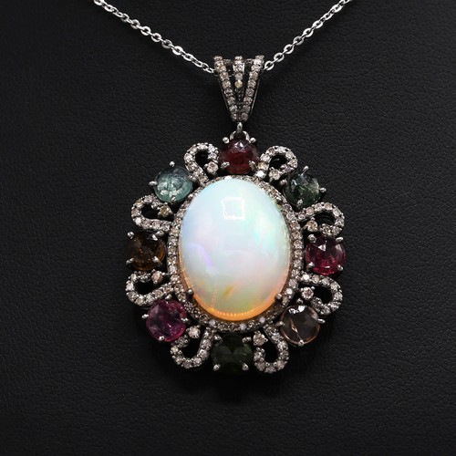 25 - Silver pendant set with large cabochon opal, multicolour tourmalines and rose-cut diamonds on a silv... 