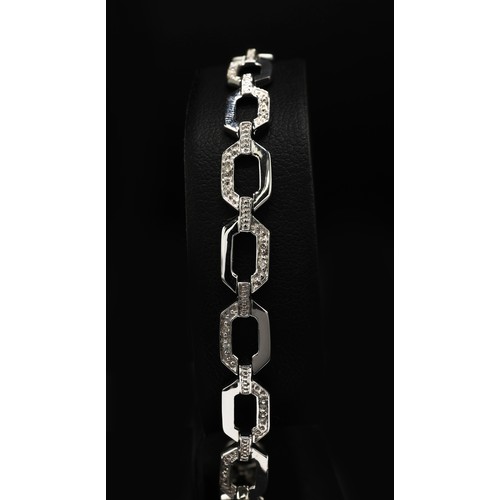 19 - 9ct white gold diamond set fancy line bracelet with lobster claw clasp, boxed. Diamonds 0.20ct appro... 